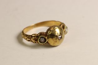 Centrally set with a small rose- cut diamond with split pearls to the sides A Small 19th Century