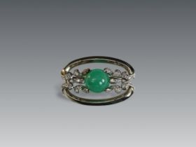 An Impressive 1940s Cabochon Emerald Diamond Brooch, set to the centre with a circular cabochon