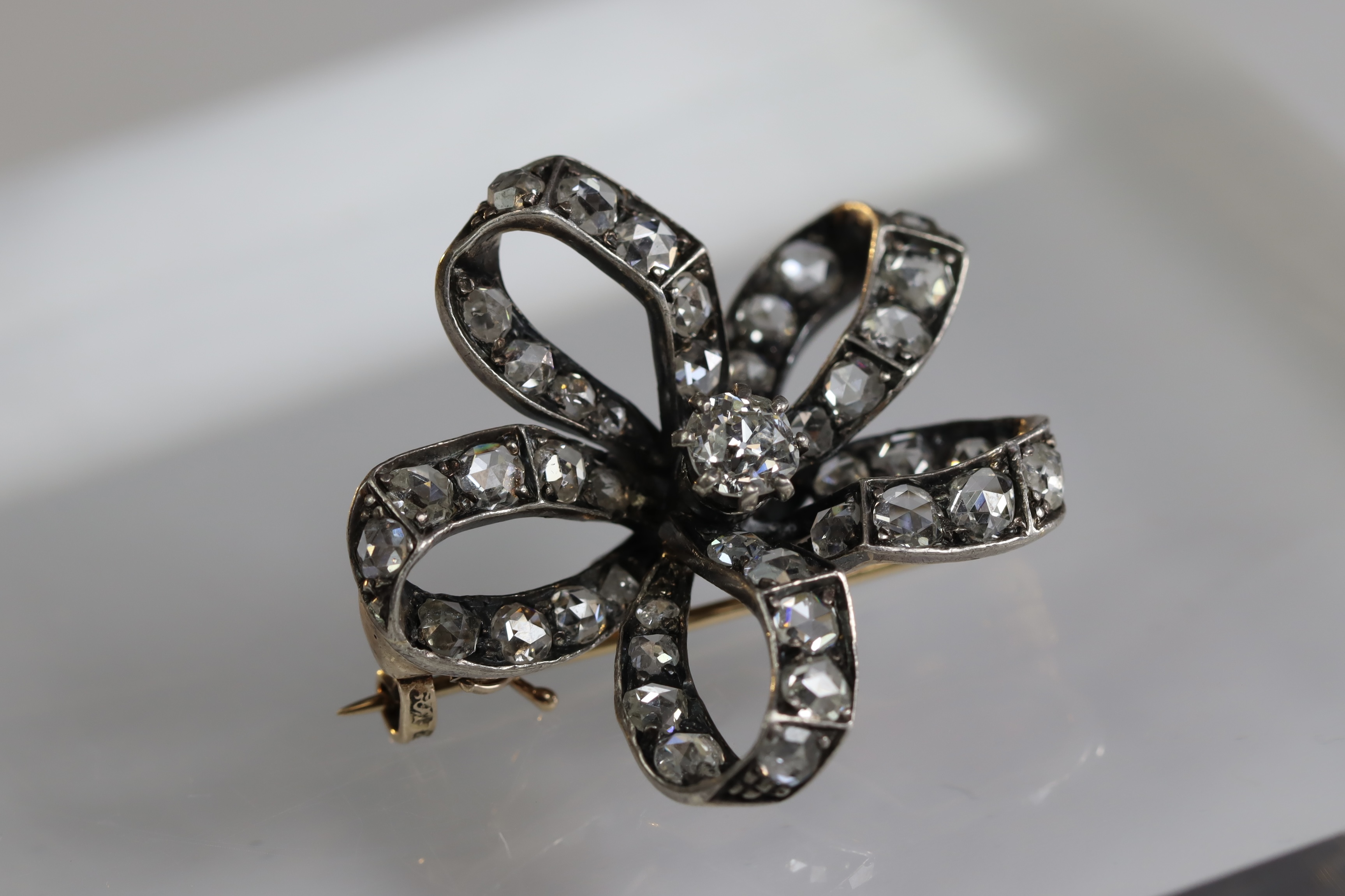 An Antique Diamond and a rose-cut Diamond Stylised Bow Brooch, circa 1890, centrally set with a - Image 2 of 13