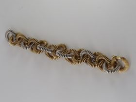 An Italian White and Yellow Gold Bracelet, 70.8 g.approx, signed with Italian marks and maker