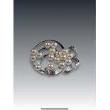 A Cultured Pearl and Silver Cluster Brooch set with sixteen 5.4mm.cultured pearls of good