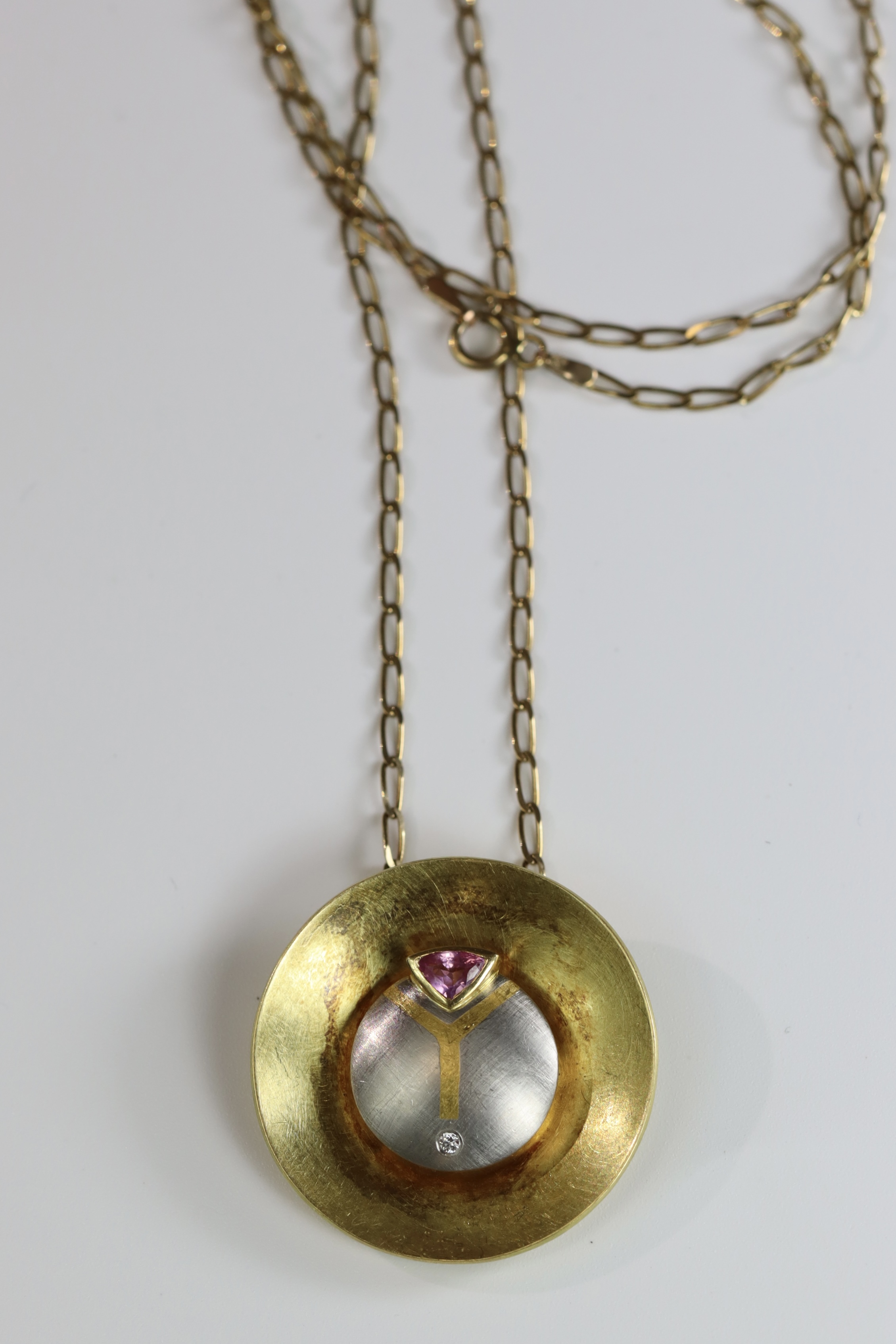 An Unusual Gold, Platinum, Diamond and Ruby Disc Pendant, on a long chain, chain set in 9 ct gold, - Image 3 of 10
