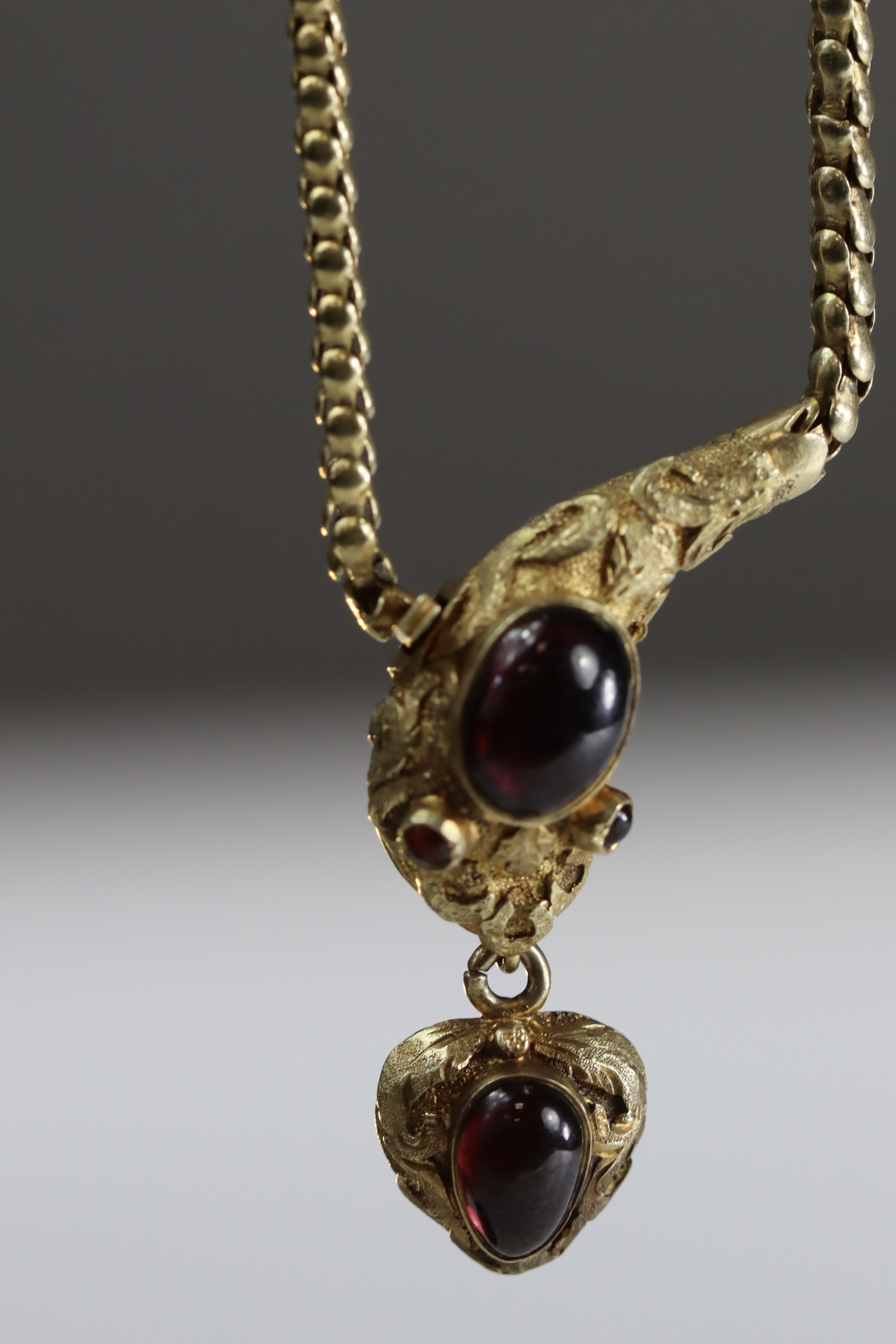 An Attractive Antique Cabochon Garnet and Yellow Gold Snake Pendant, circa 1870,the head formed from - Image 10 of 10