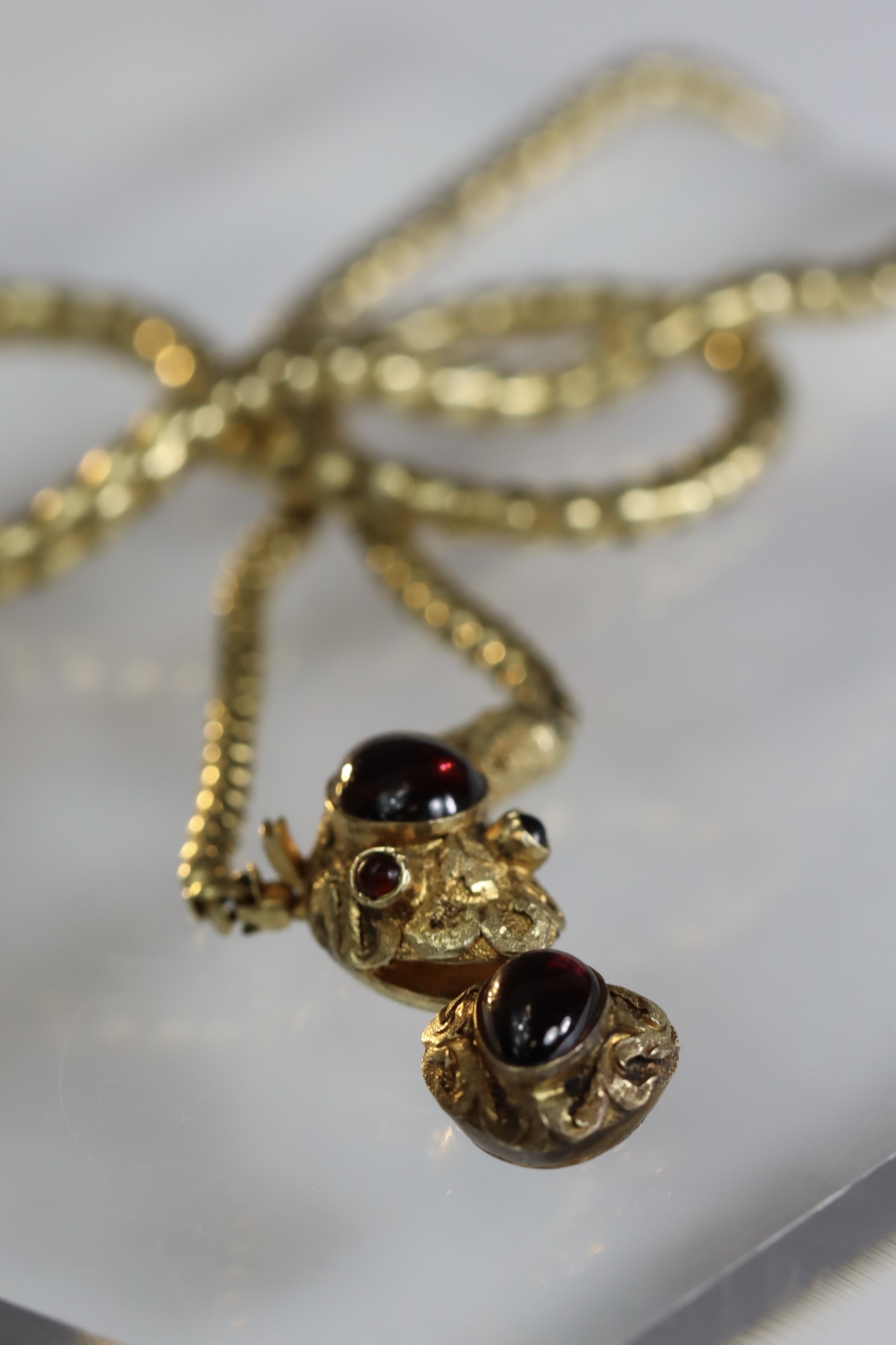 An attractive Antique Cabochon Garnet and Yellow Gold Snake Pendant, circa 1870,the head formed from - Image 2 of 13