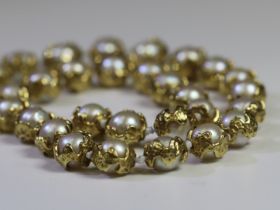 A Charles de Temple wrap around Gold and Pearl Necklace . Signed C de T 67.6 g approx. 67.6 g
