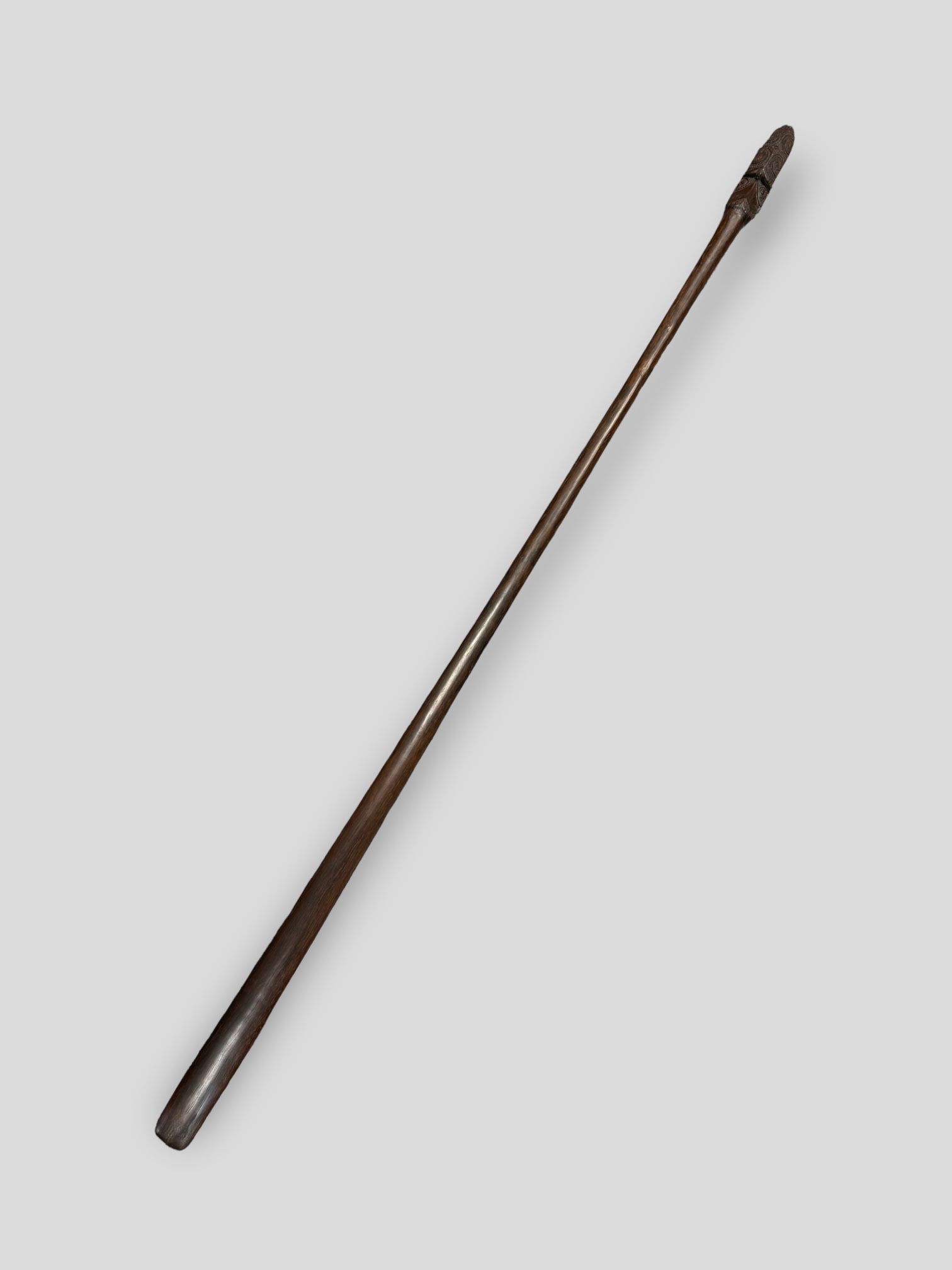 A Maori Taiaha Staff. New Zealand, ca 19th century.Typically carved with two pairs of eyes and