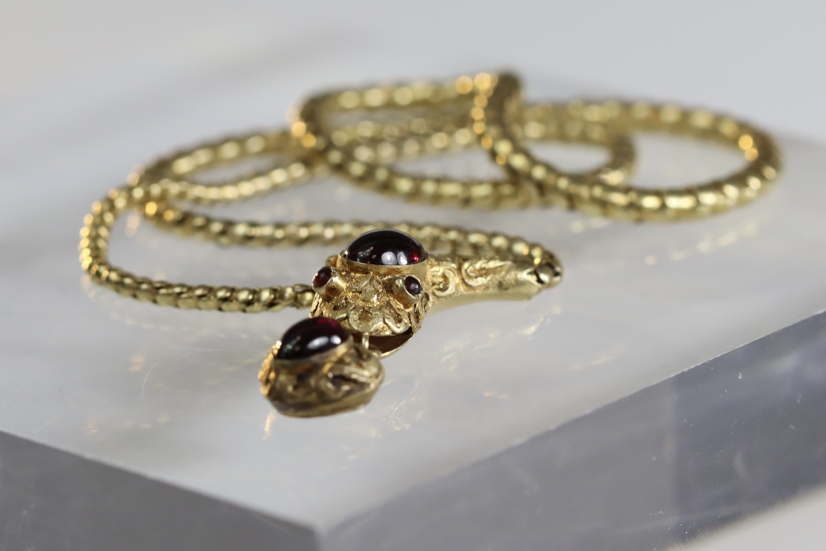 An attractive Antique Cabochon Garnet and Yellow Gold Snake Pendant, circa 1870,the head formed from - Image 8 of 13