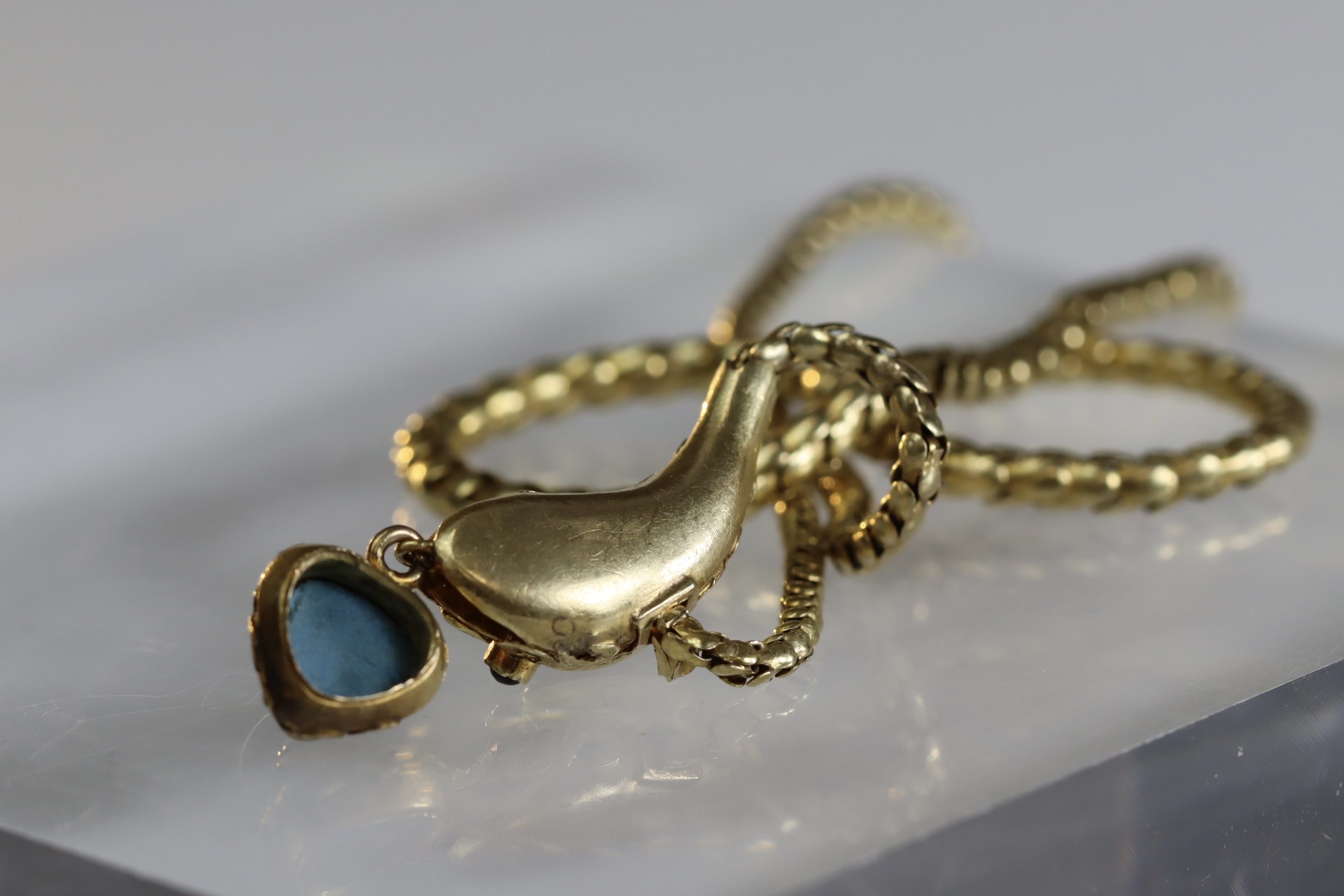 An attractive Antique Cabochon Garnet and Yellow Gold Snake Pendant, circa 1870,the head formed from - Image 5 of 13