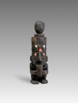 A Huari Wari Culture Wooden Snuff Vessel with Figure. Peru ca. 500-1000 AD.A fine wooden carving