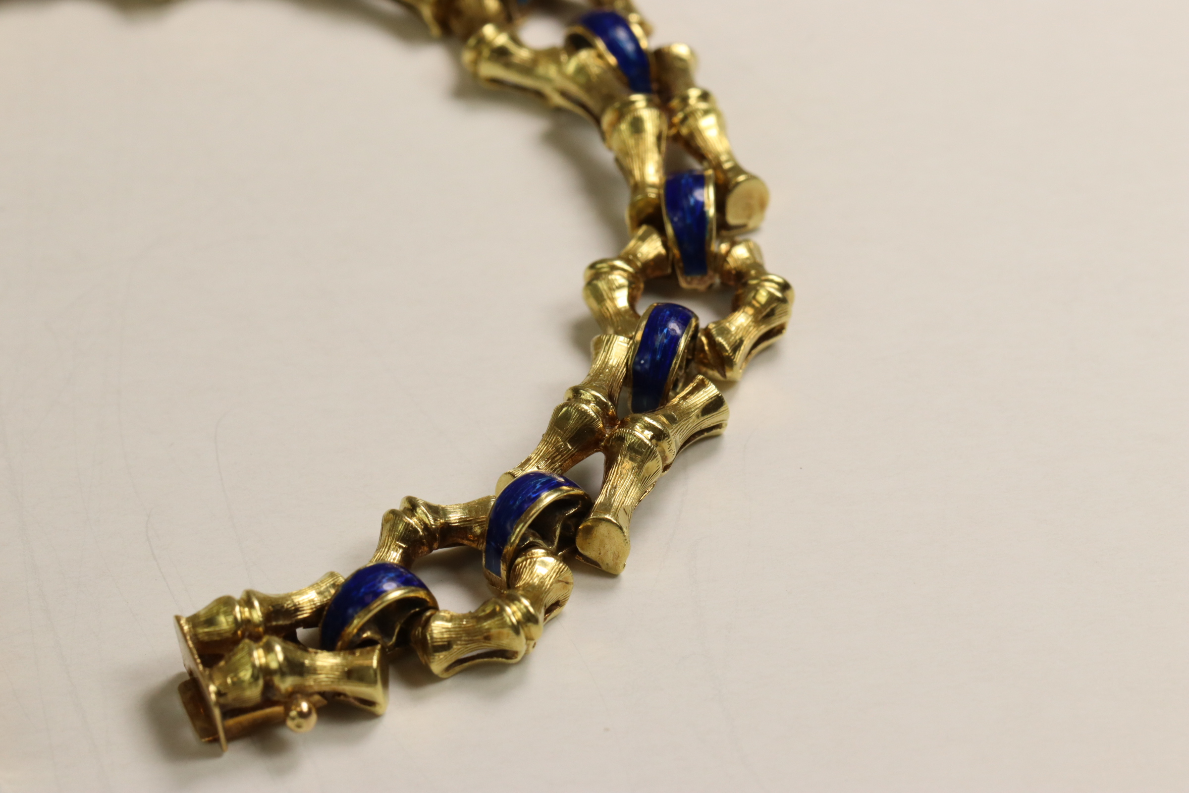 A 1970s 18 Carat Yellow Gold and Enamel Bracelet,Of bamboo design with royal blue enamelled - Image 3 of 11