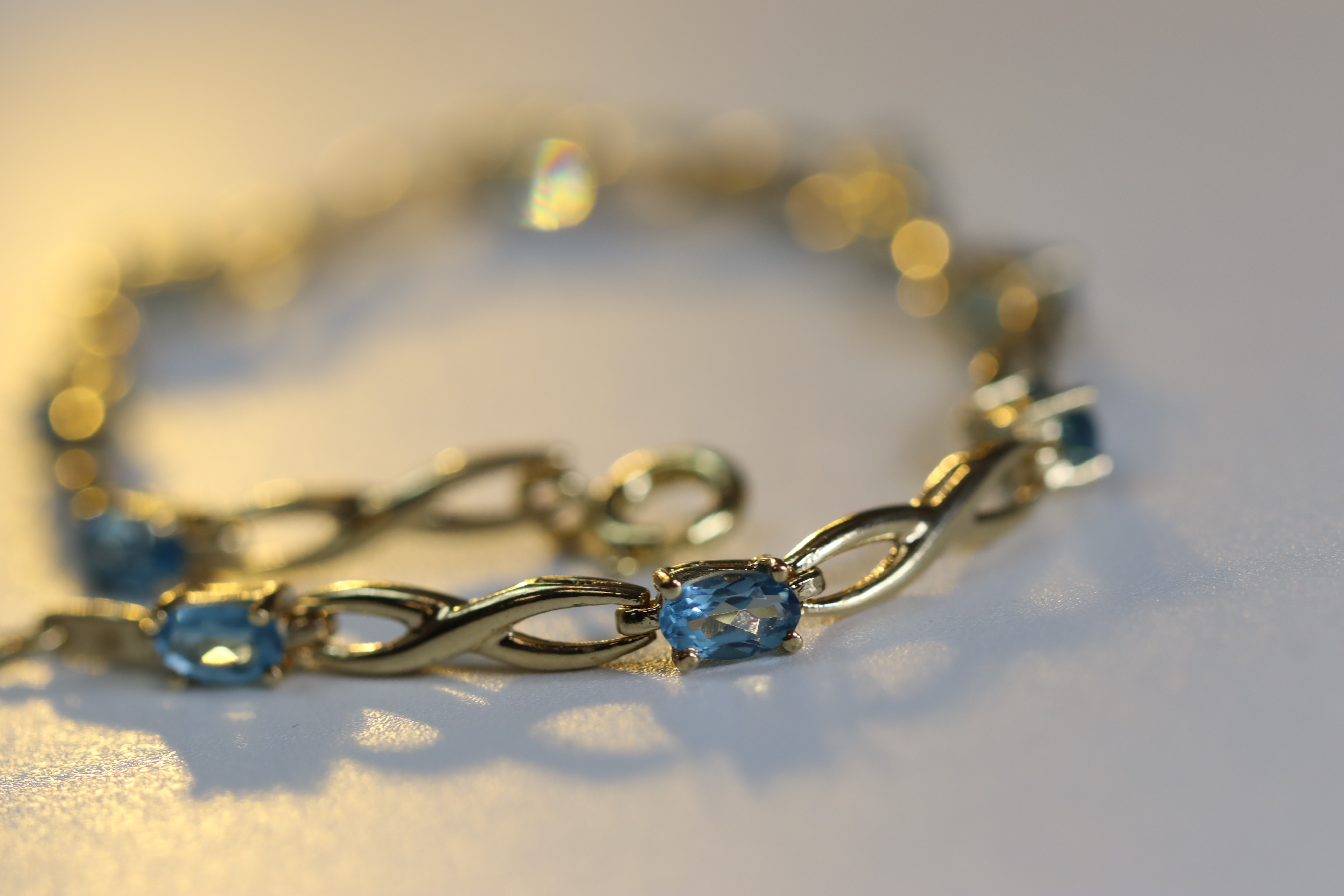 A Blue Topaz and Yellow Metal Line Bracelet A Blue Topaz and Yellow Metal Line Bracelet, set with - Image 5 of 8