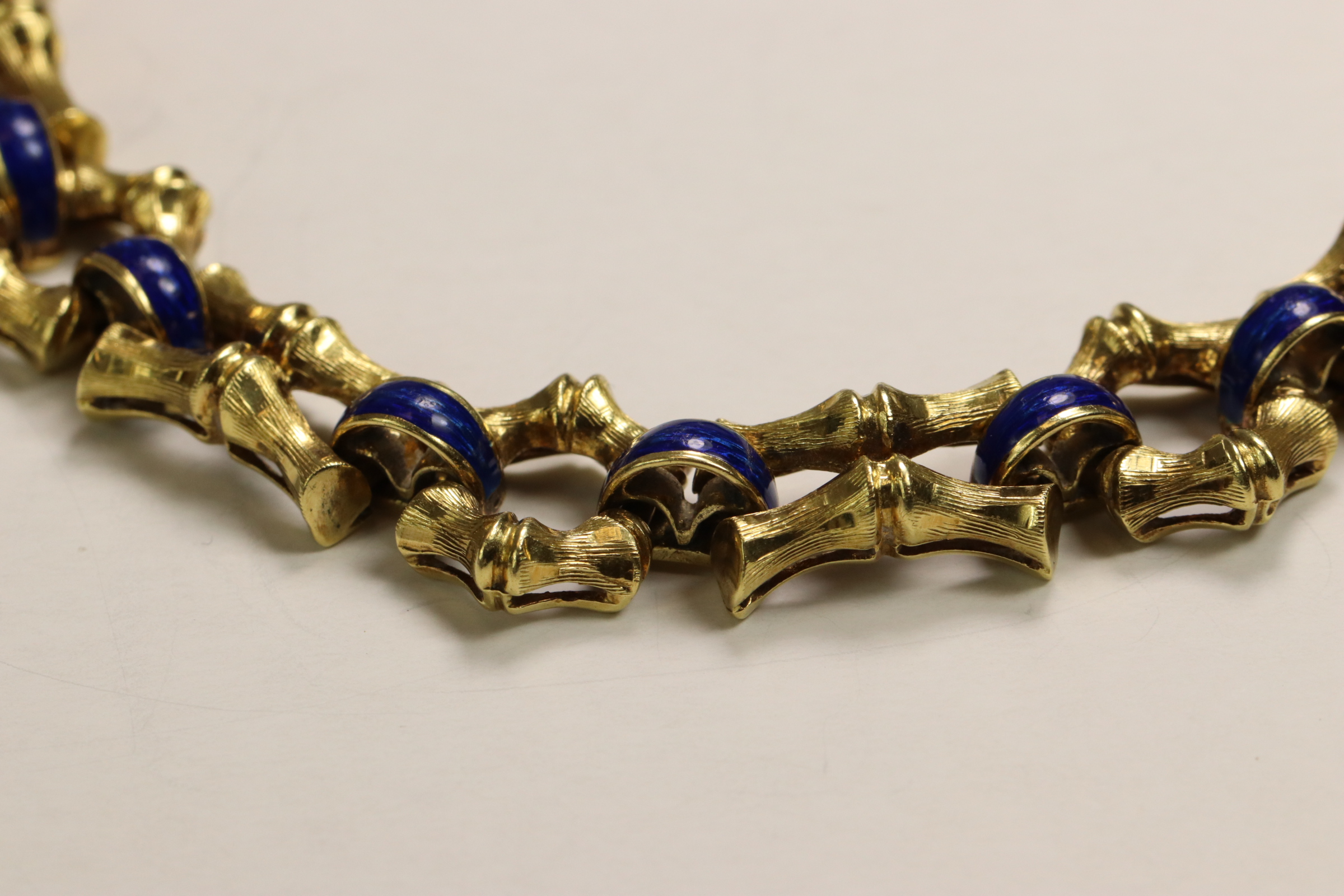 A 1970s 18 Carat Yellow Gold and Enamel Bracelet,Of bamboo design with royal blue enamelled - Image 10 of 11