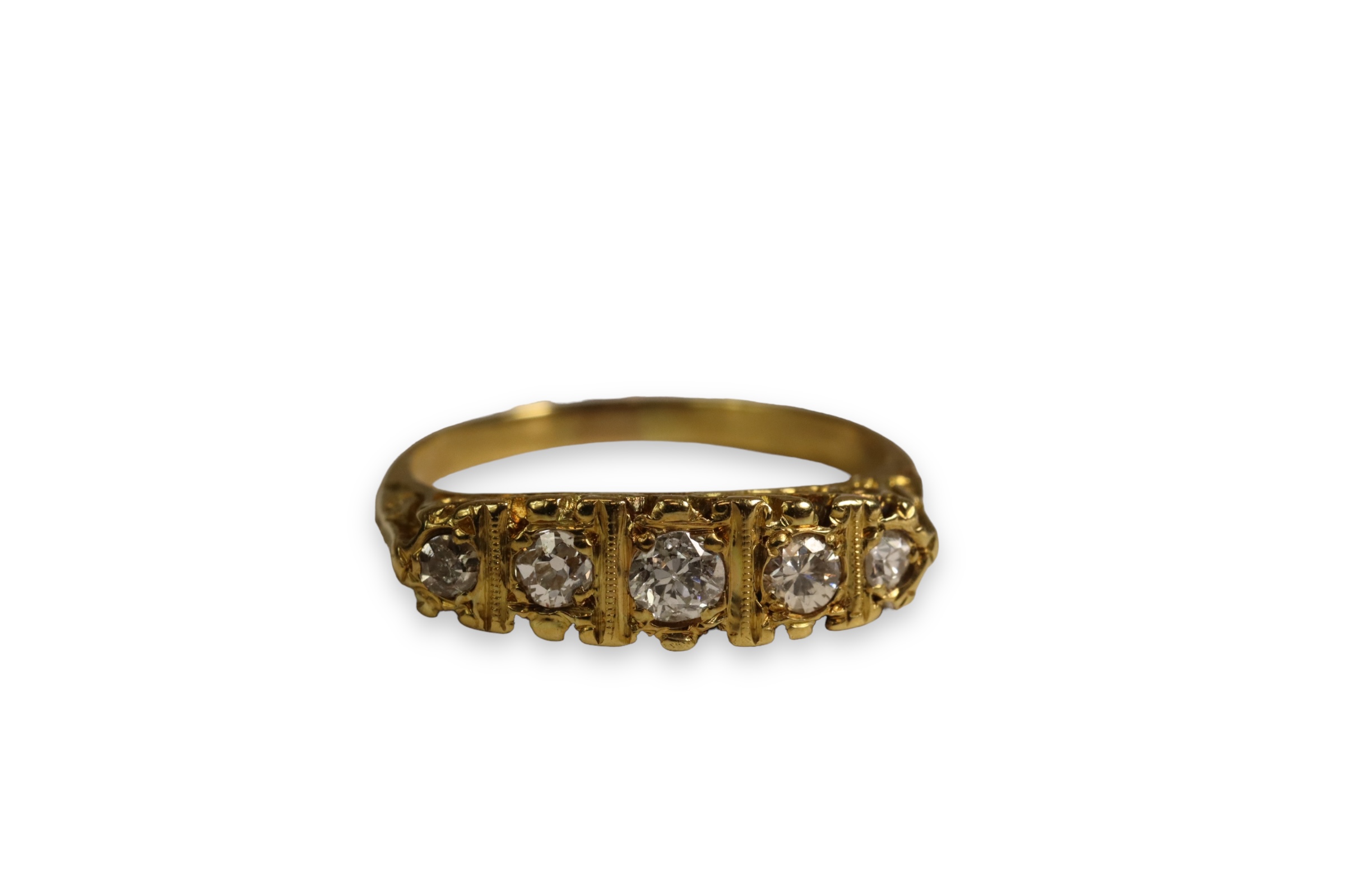 A Diamond Five Stone Ring, The graduated old brilliant cut diamonds mounted in a carved 18 ct