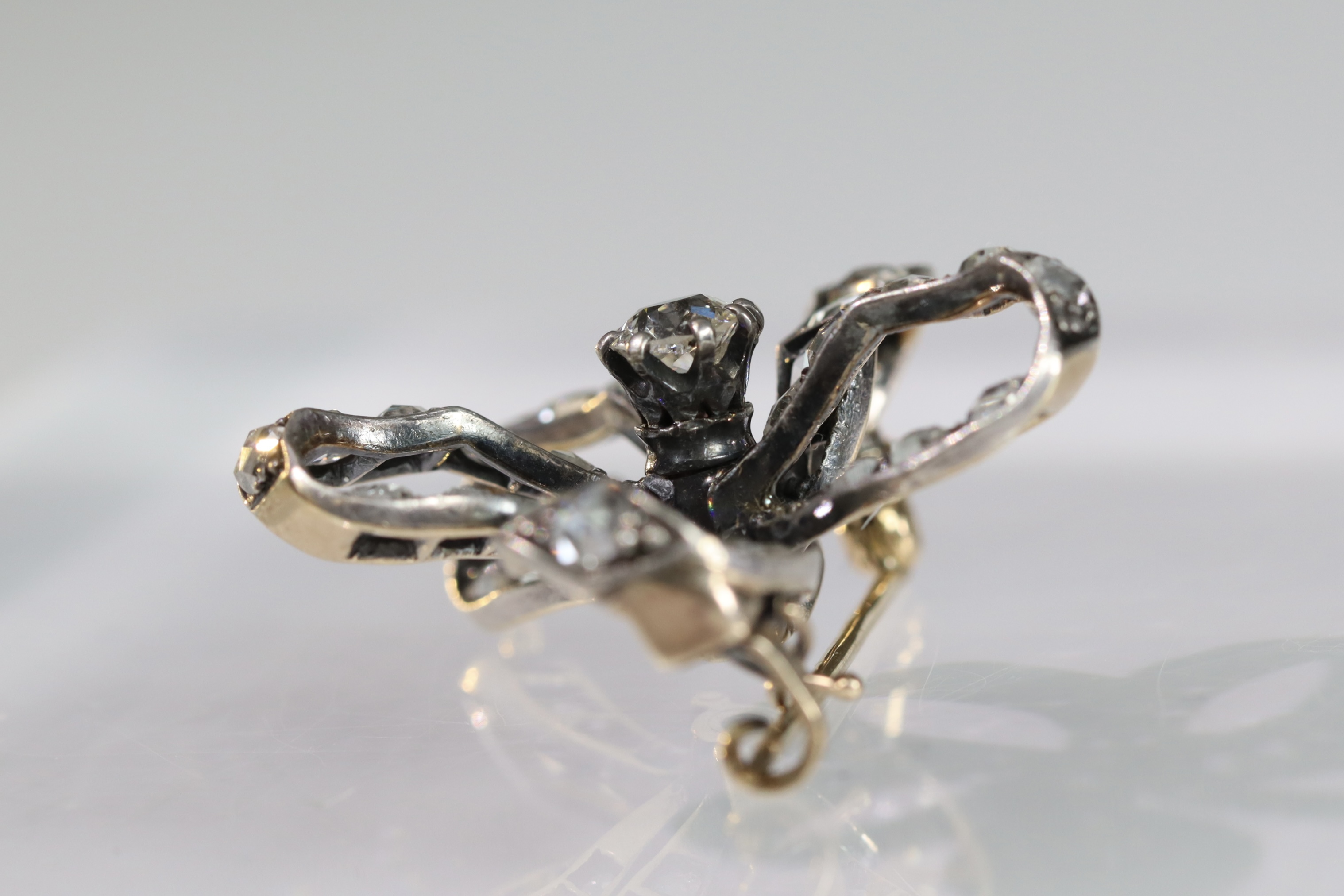 An Antique Diamond and a rose-cut Diamond Stylised Bow Brooch, circa 1890, centrally set with a - Image 9 of 13