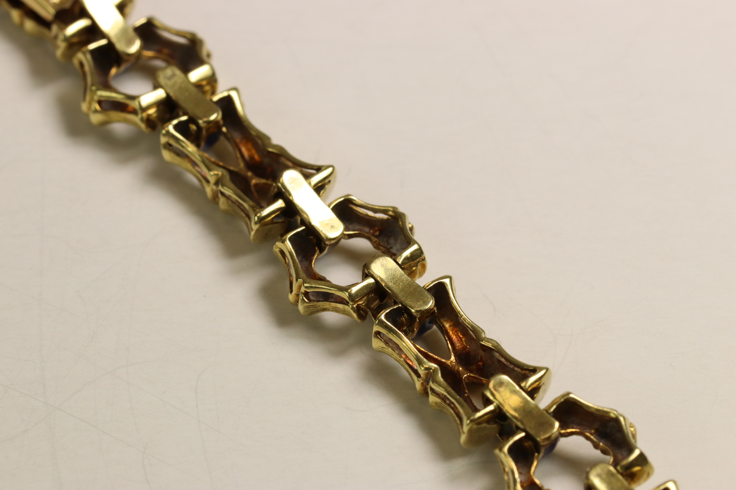 A 1970s 18 Carat Yellow Gold and Enamel Bracelet,Of bamboo design with royal blue enamelled - Image 9 of 11