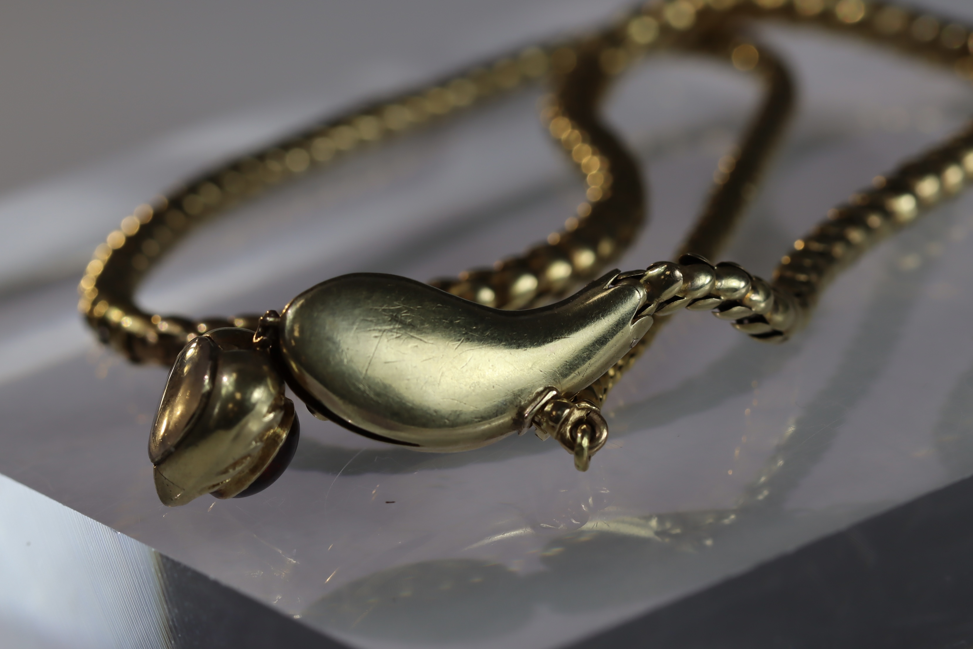 An attractive Antique Cabochon Garnet and Yellow Gold Snake Pendant, circa 1870,the head formed from - Image 13 of 13