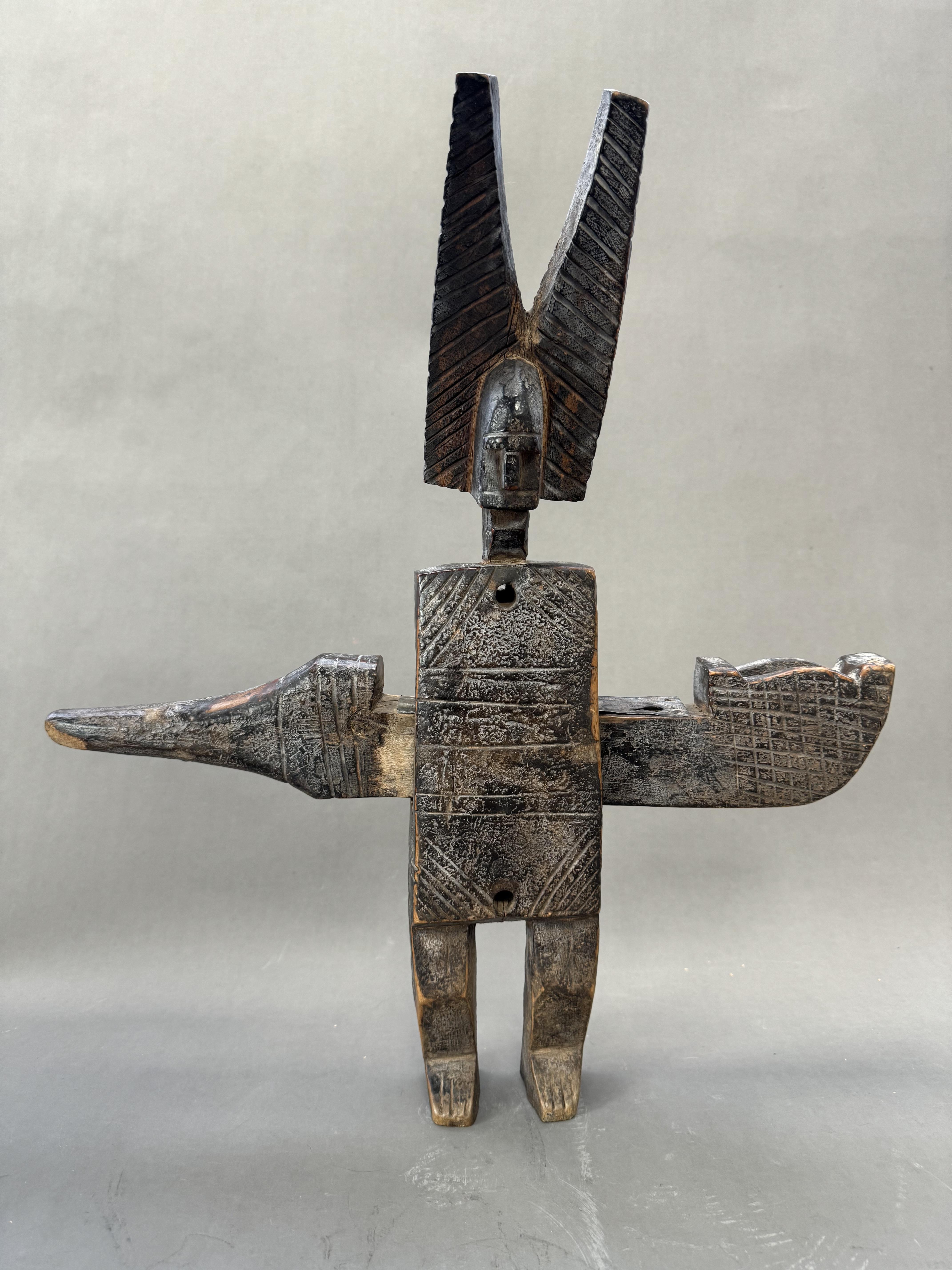 A Bamana Spiritual Figure Door Lock. Mali.A large door lock shaped as a mythical figure, wearing a