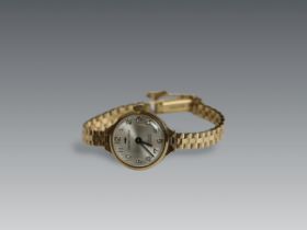 A Lady's 9 carat Yellow Gold Wristwatch by Jaquet -Droz, circa 1950,the circular dial with black