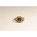 A Victorian 15 carat Gold and Garnet Ring, circa. 1870.Set to the centre with an oval shaped