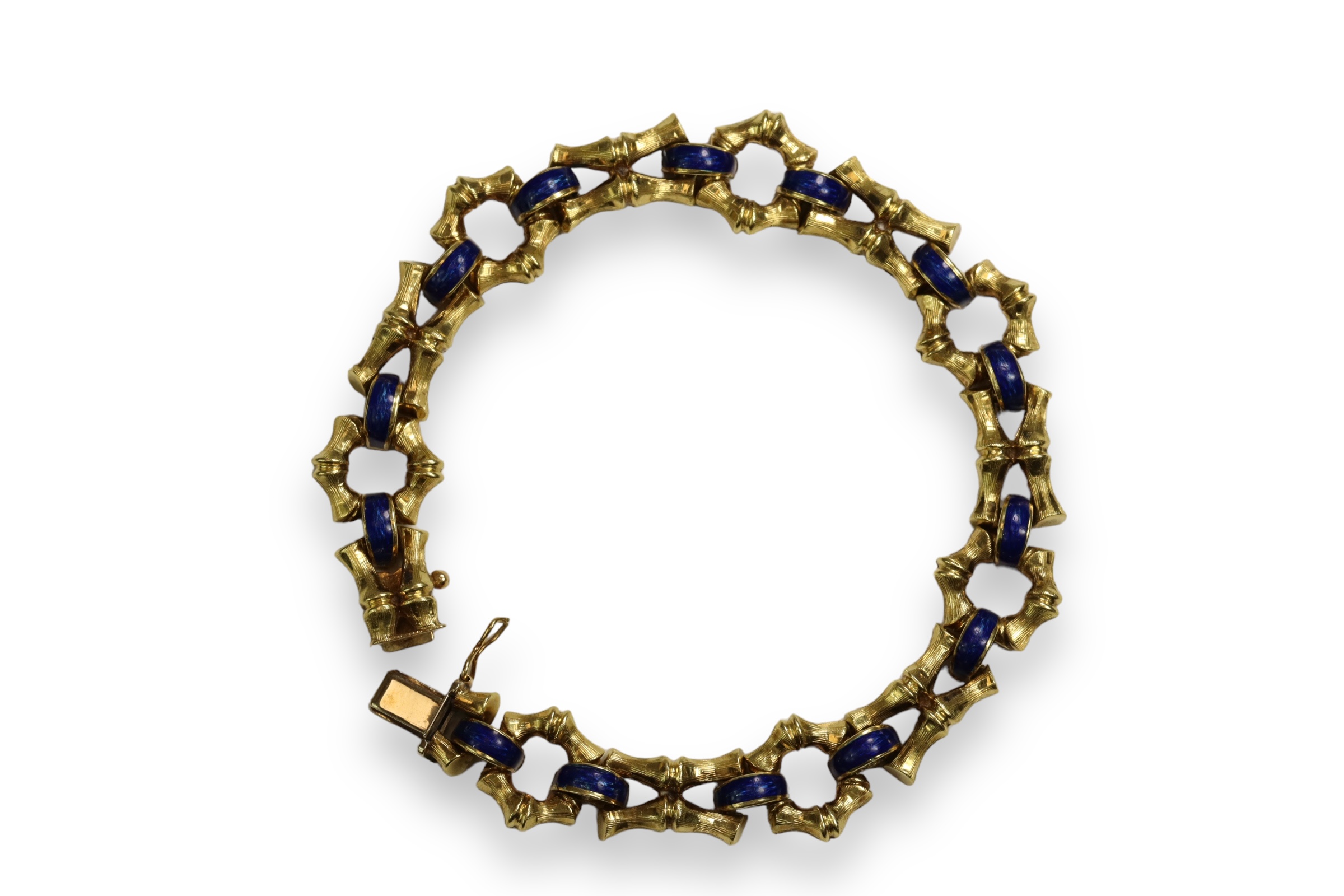 A 1970s 18 Carat Yellow Gold and Enamel Bracelet,Of bamboo design with royal blue enamelled