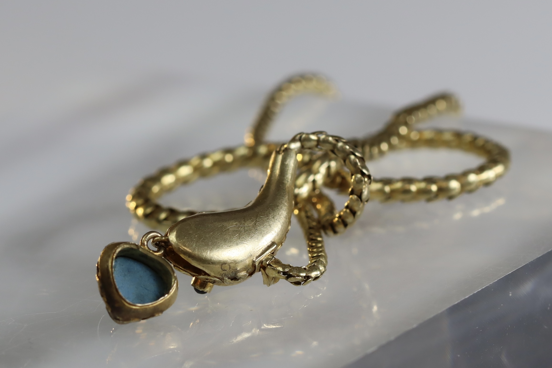 An attractive Antique Cabochon Garnet and Yellow Gold Snake Pendant, circa 1870,the head formed from - Image 4 of 13