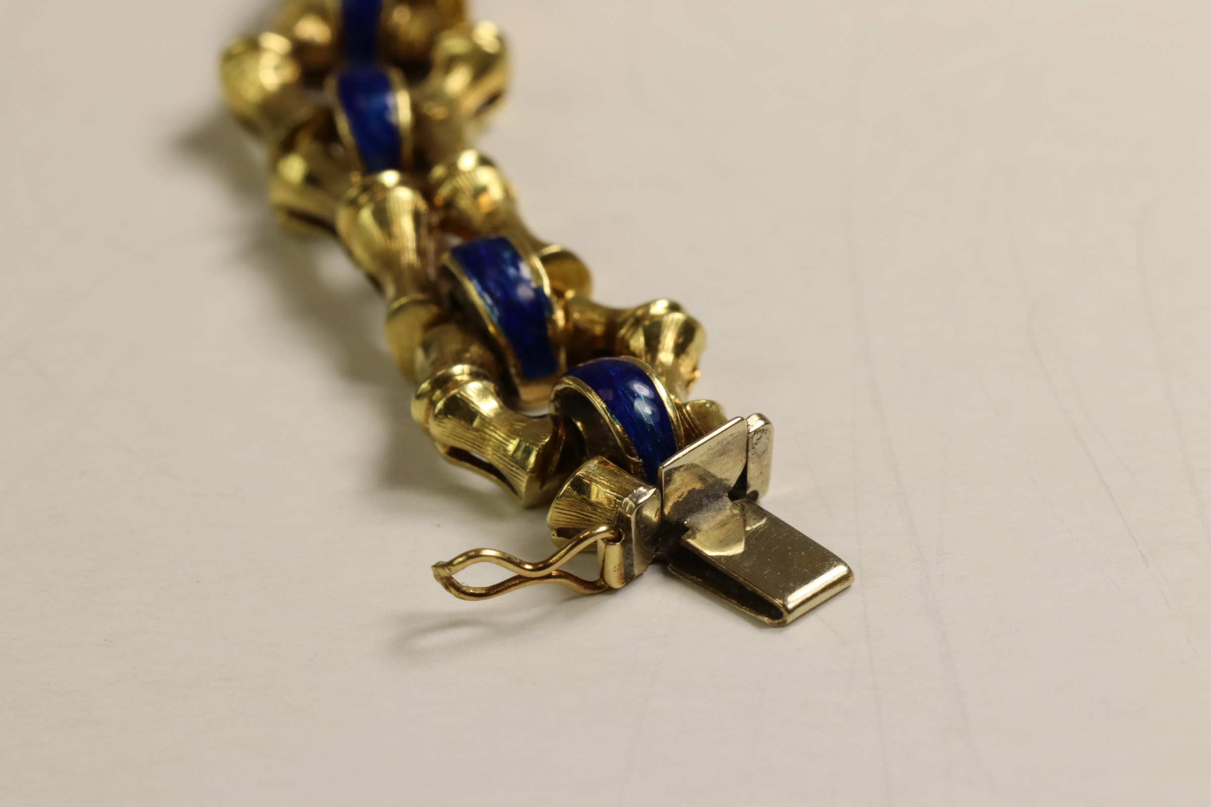 A 1970s 18 Carat Yellow Gold and Enamel Bracelet,Of bamboo design with royal blue enamelled - Image 4 of 11