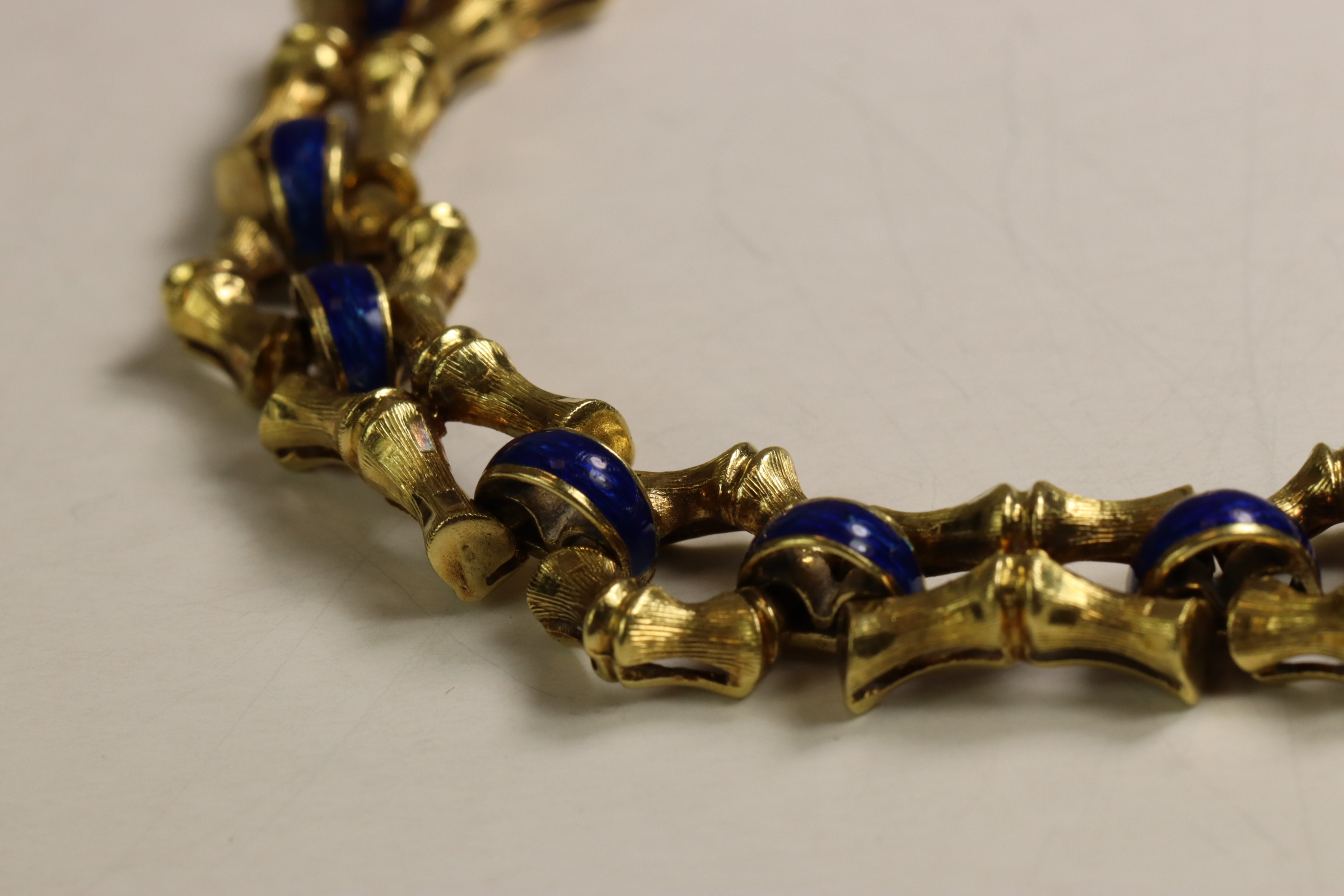 A 1970s 18 Carat Yellow Gold and Enamel Bracelet,Of bamboo design with royal blue enamelled - Image 5 of 11