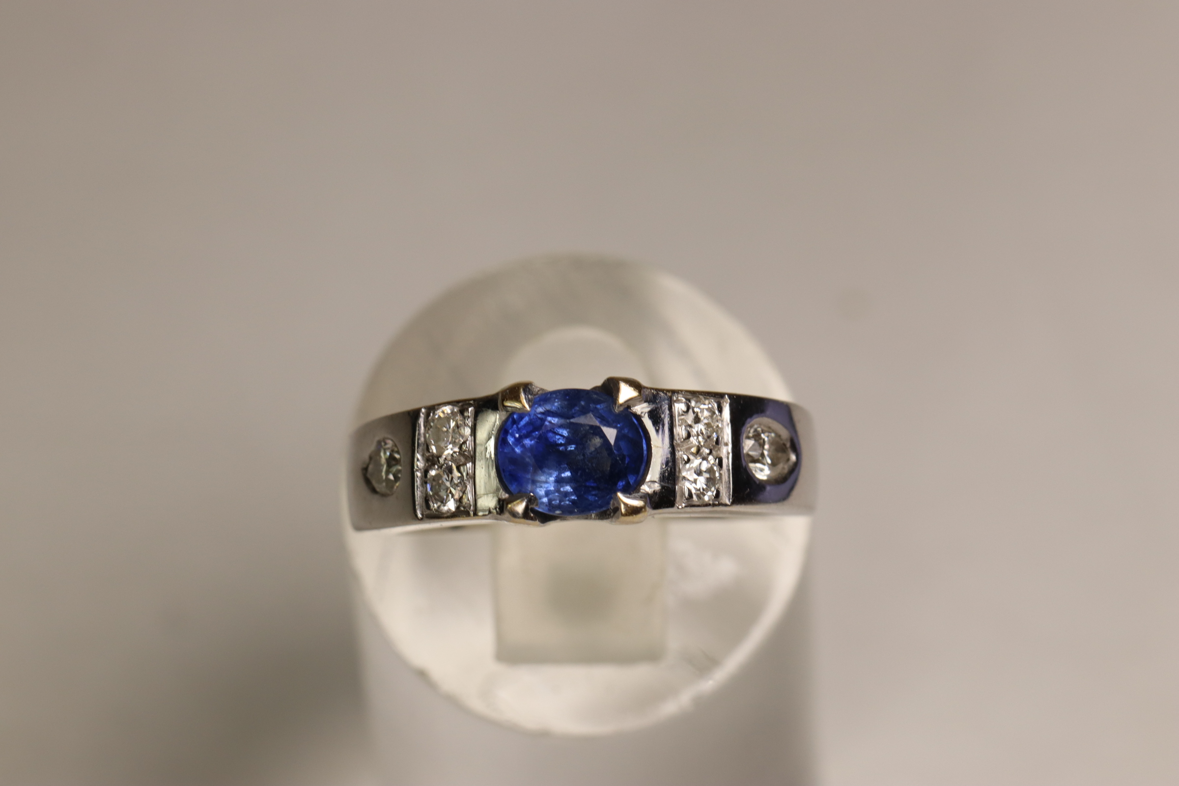 A Sapphire and Diamond Dress Ring, Circa 1990 A Sapphire and Diamond Dress Ring, Circa 1990 The oval - Image 2 of 5
