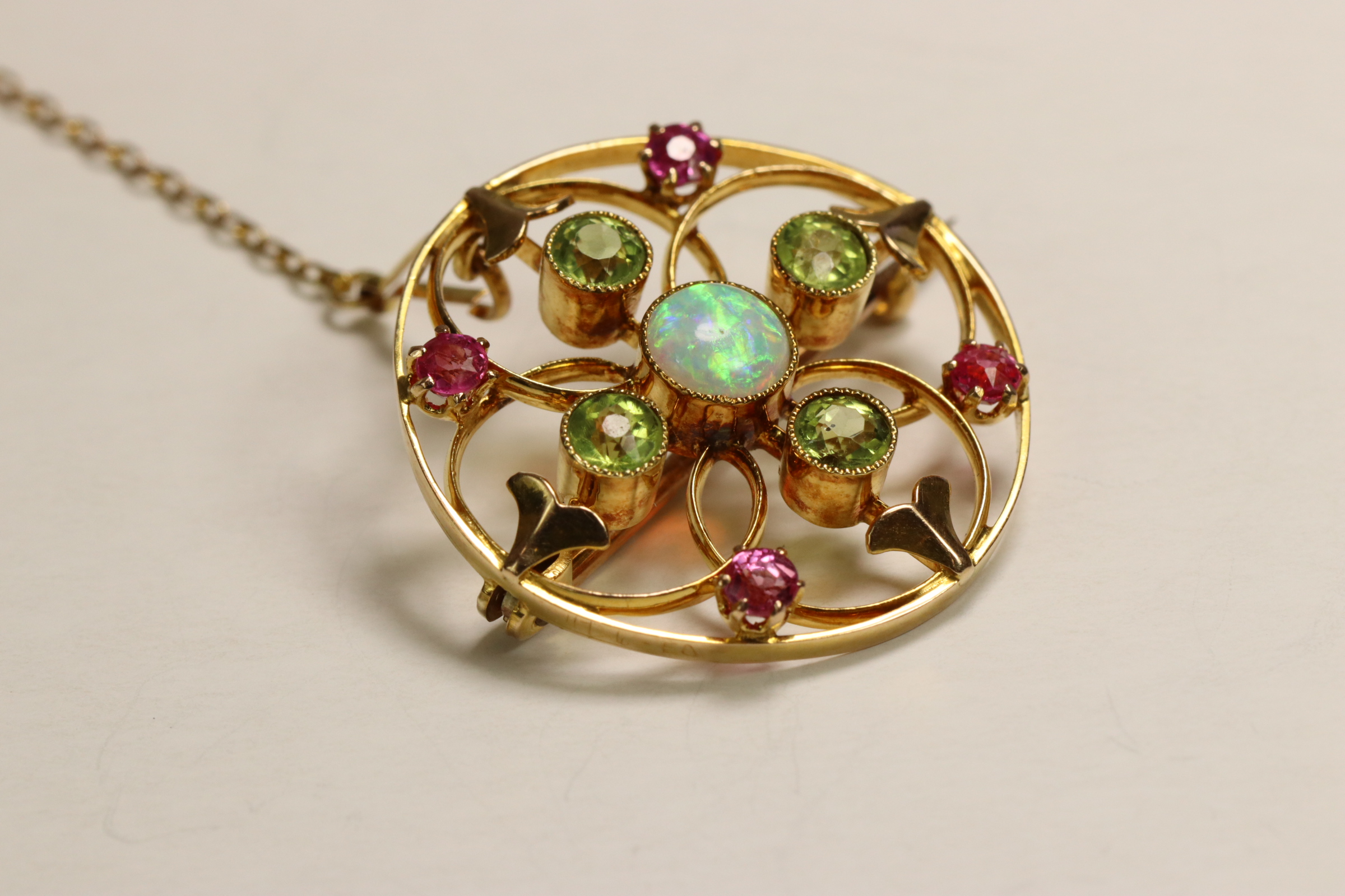 An Antique Opal, Peridot and Pink Stone Target Brooch, circa 1910 Millegraine set central opal, - Image 3 of 7