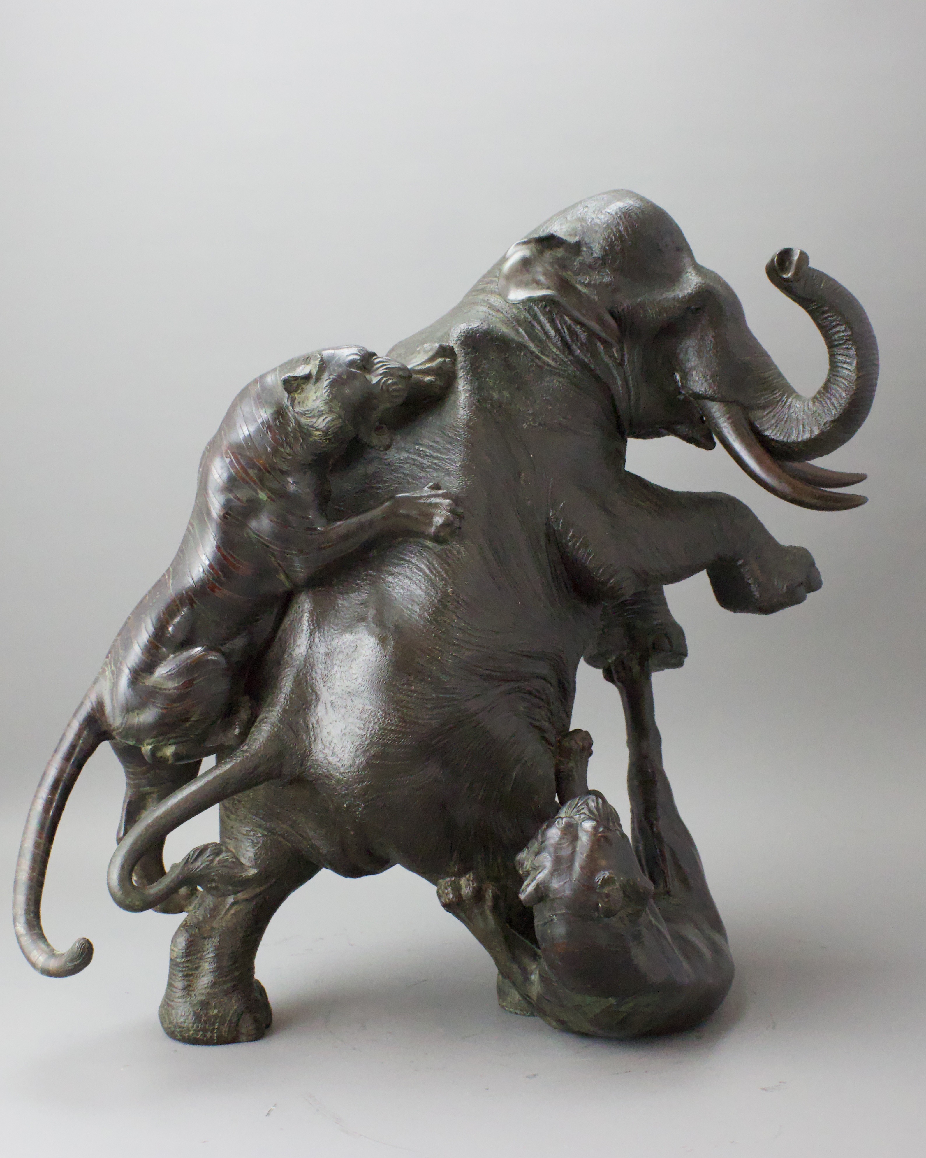 A Japanese Bronze Elephant and Tigers Group, Meiji period,with one seal, the enraged elephant in - Image 4 of 14