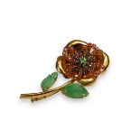 A Stylish 18 ct Gold and Gem set Flower Brooch, The large flower set with small rubies and sapphires