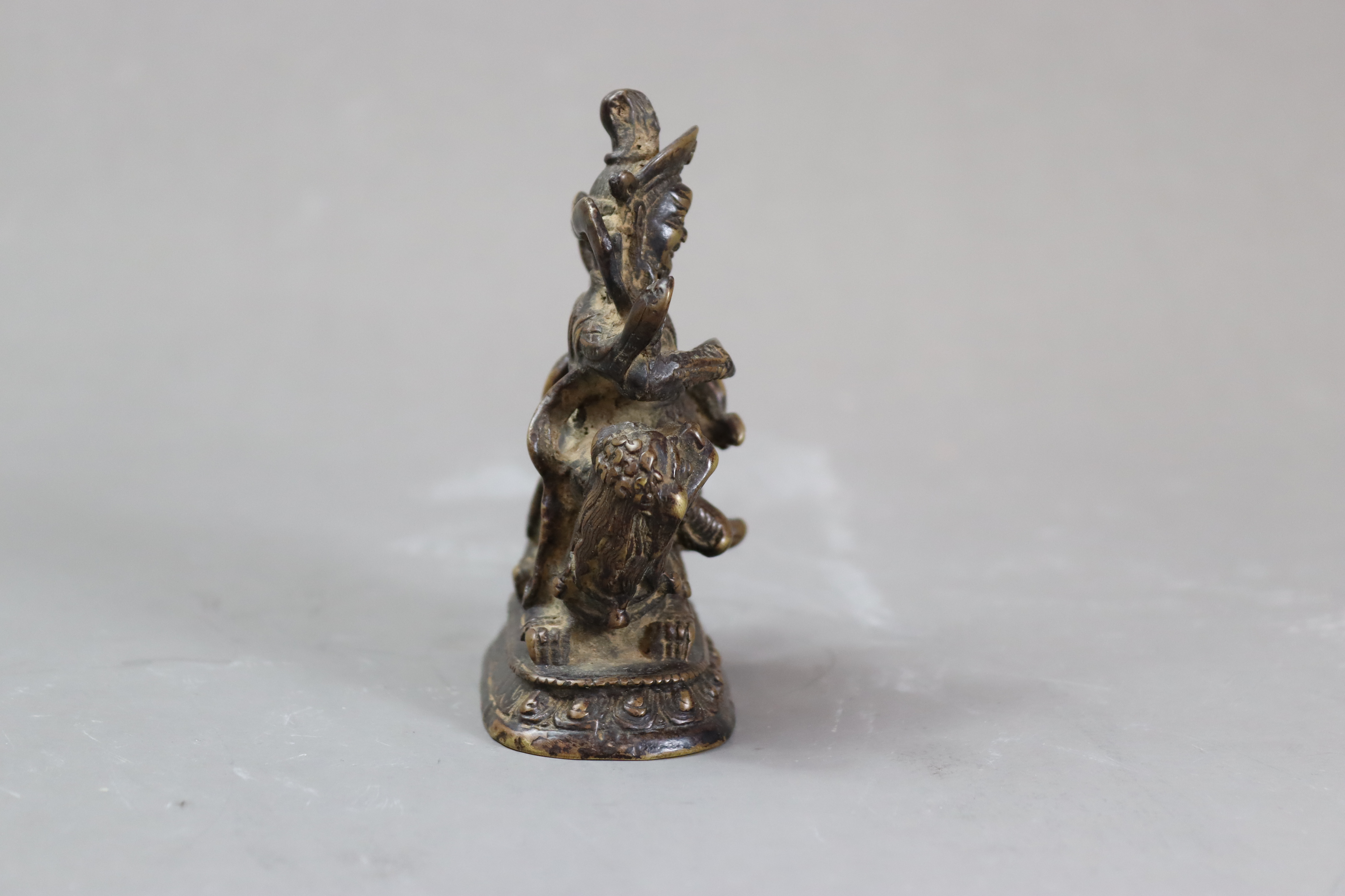 A Bronze God of Fortune, 19/20th centurythe fierce bearded deity clutching his mongoose, with dark - Image 4 of 8