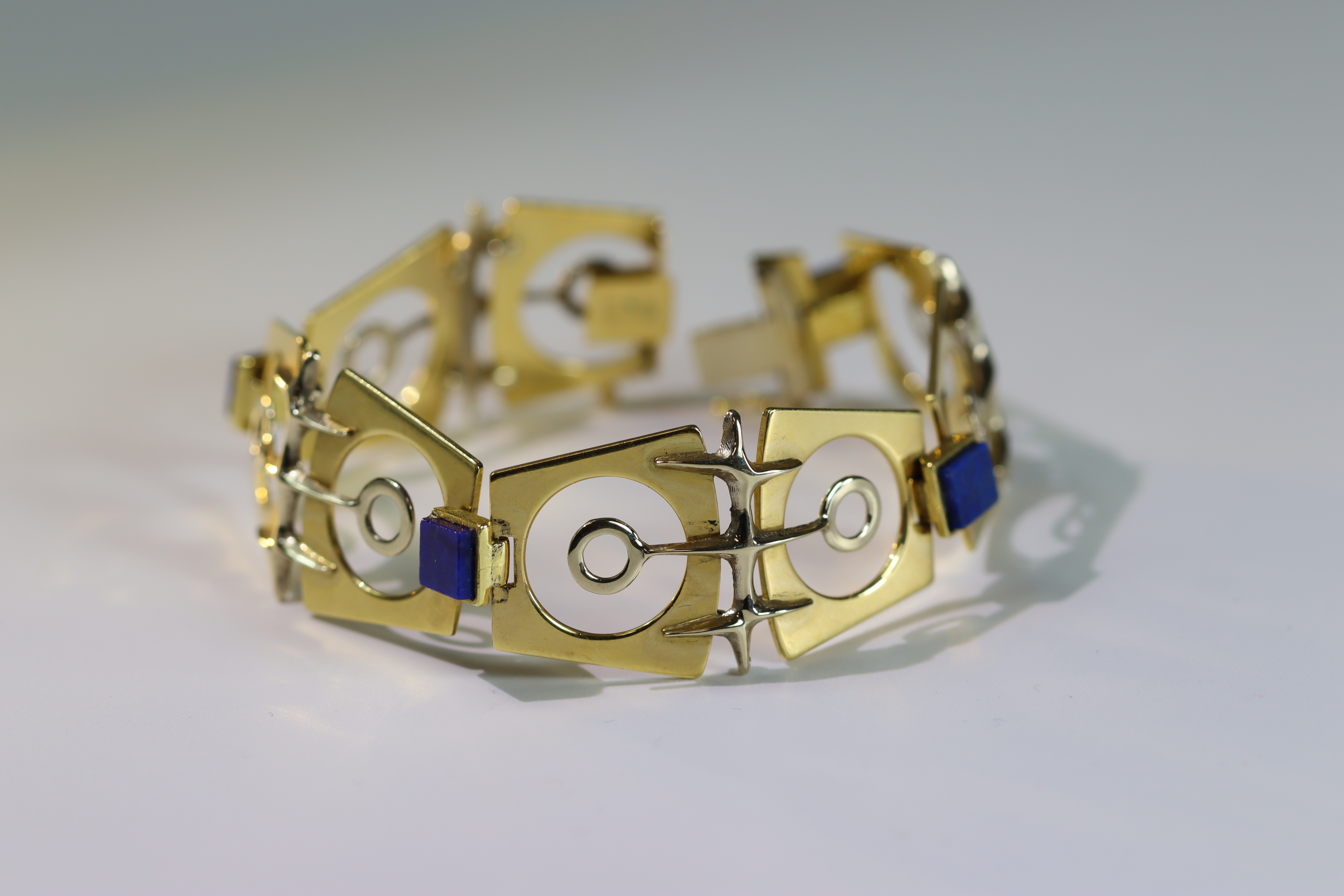 An Italian 18k Gold Bracelet set with Lapis lazuli, designed by Galoppi. Fully signed. Weight 44.