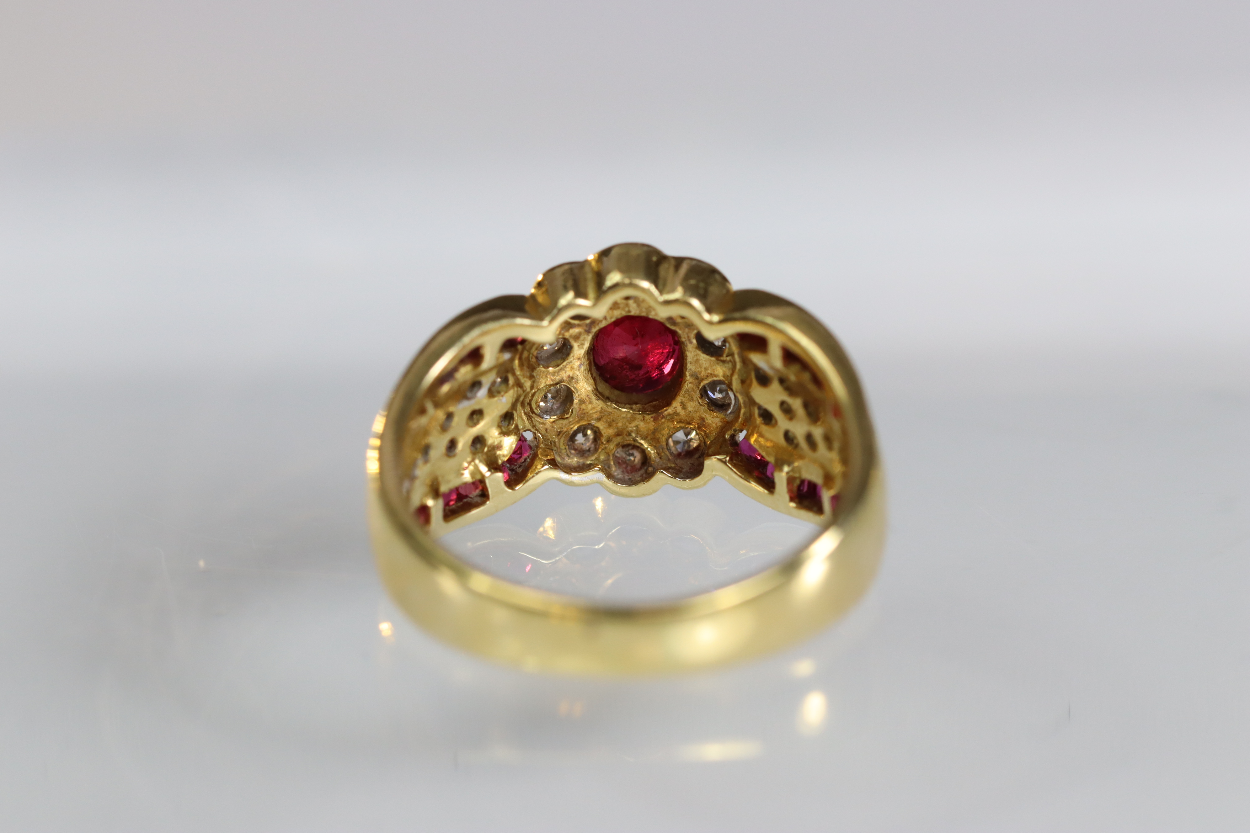 A contemporary 18 carat Yellow Gold, Ruby and Diamond Dress Ring,the oval shaped ruby central - Image 9 of 14