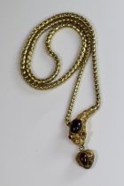 An Attractive Antique Cabochon Garnet and Yellow Gold Snake Pendant, circa 1870,the head formed from