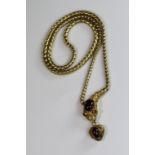 An Attractive Antique Cabochon Garnet and Yellow Gold Snake Pendant, circa 1870,the head formed from