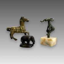 Three bronze Beasts, 19th century and earlierincluding a prancing horse, an elephant, and a Luristan