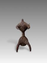 A Fang People Iron and Leather Figurine. West Africa.The figurine made of leather strings bound