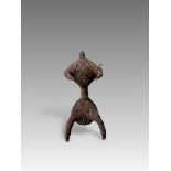 A Fang People Iron and Leather Figurine. West Africa.The figurine made of leather strings bound