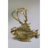 G. Weil. An 18k Gold Fish shaped pendant set with diamonds, no date mark but definitely 1970s.