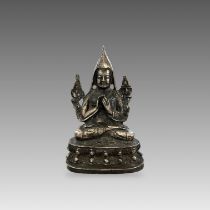 A white metal Seated Tsongkhapa, 19/20th centuryon a waisted lotus plinth, sealed, H: 19.5cm,