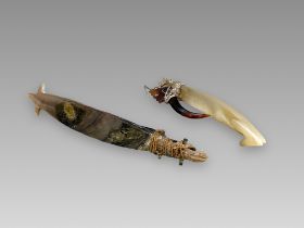 A pair of fish hooks. Solomon Islands. Ca. 19th century.A pair of A fish hooks made of shell and