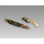 A pair of fish hooks. Solomon Islands. Ca. 19th century.A pair of A fish hooks made of shell and