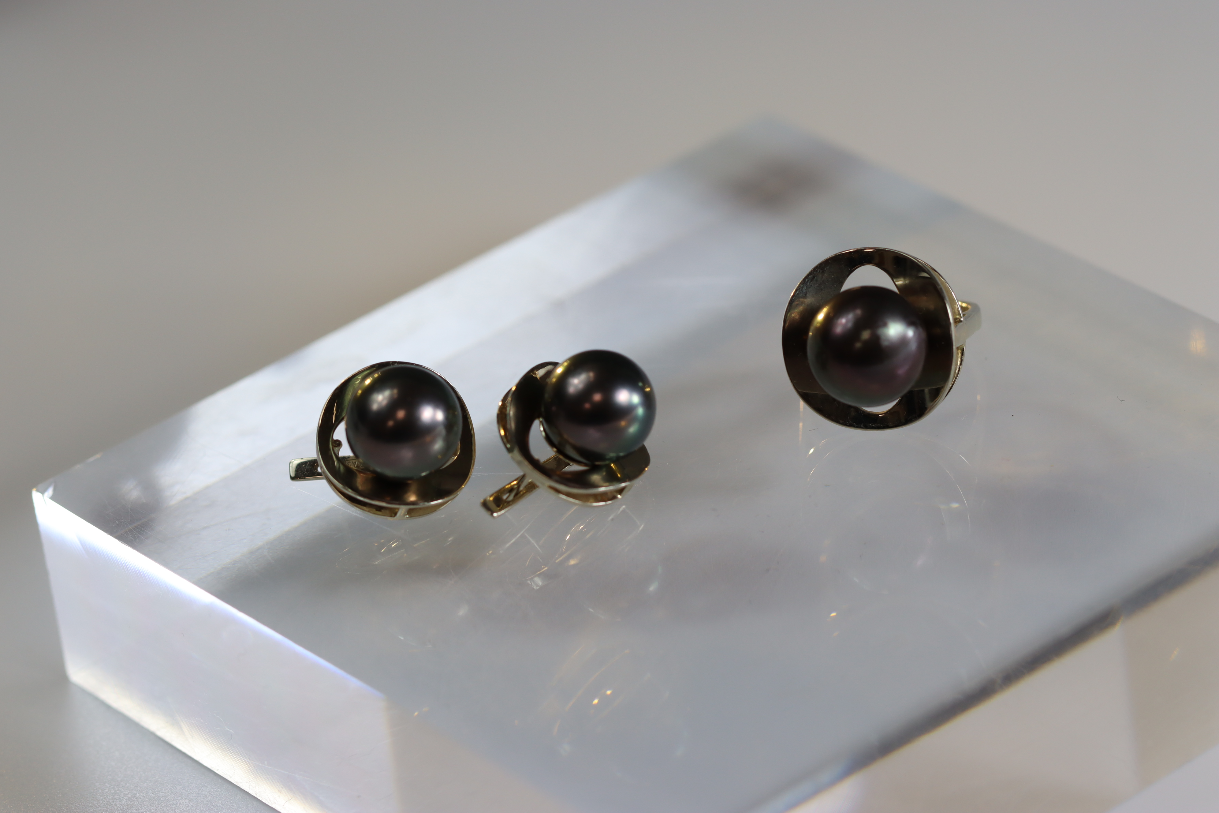 A Pair of Tahitian Black Cultured Pearl Earclips and a matching single Tahitian black cultured pearl