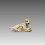 A Pottery seated Sheepdog, Song/Yuan dynastyA Pottery seated Sheepdog, Song/Yuan dynasty L:16cm.