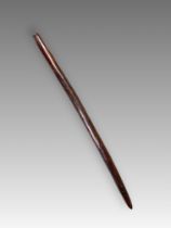 An aboriginal wooden war club. S.E. Australia ca. 19th Century.A war club with finely grooved linear