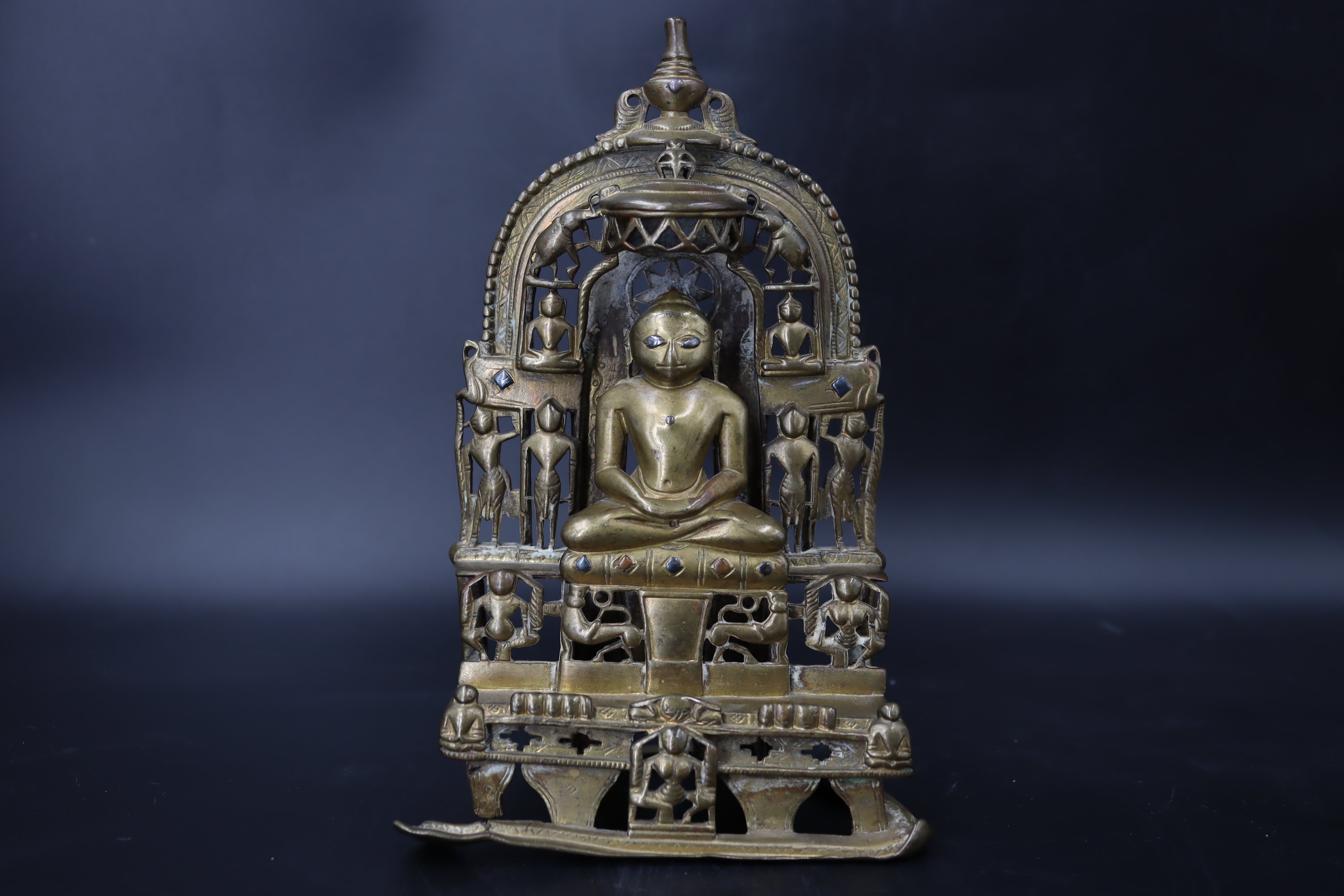 A Bronze Jain shrine. India 15th century.A Jain shrine depicting a Tirthankara with silver inlaid - Image 9 of 18