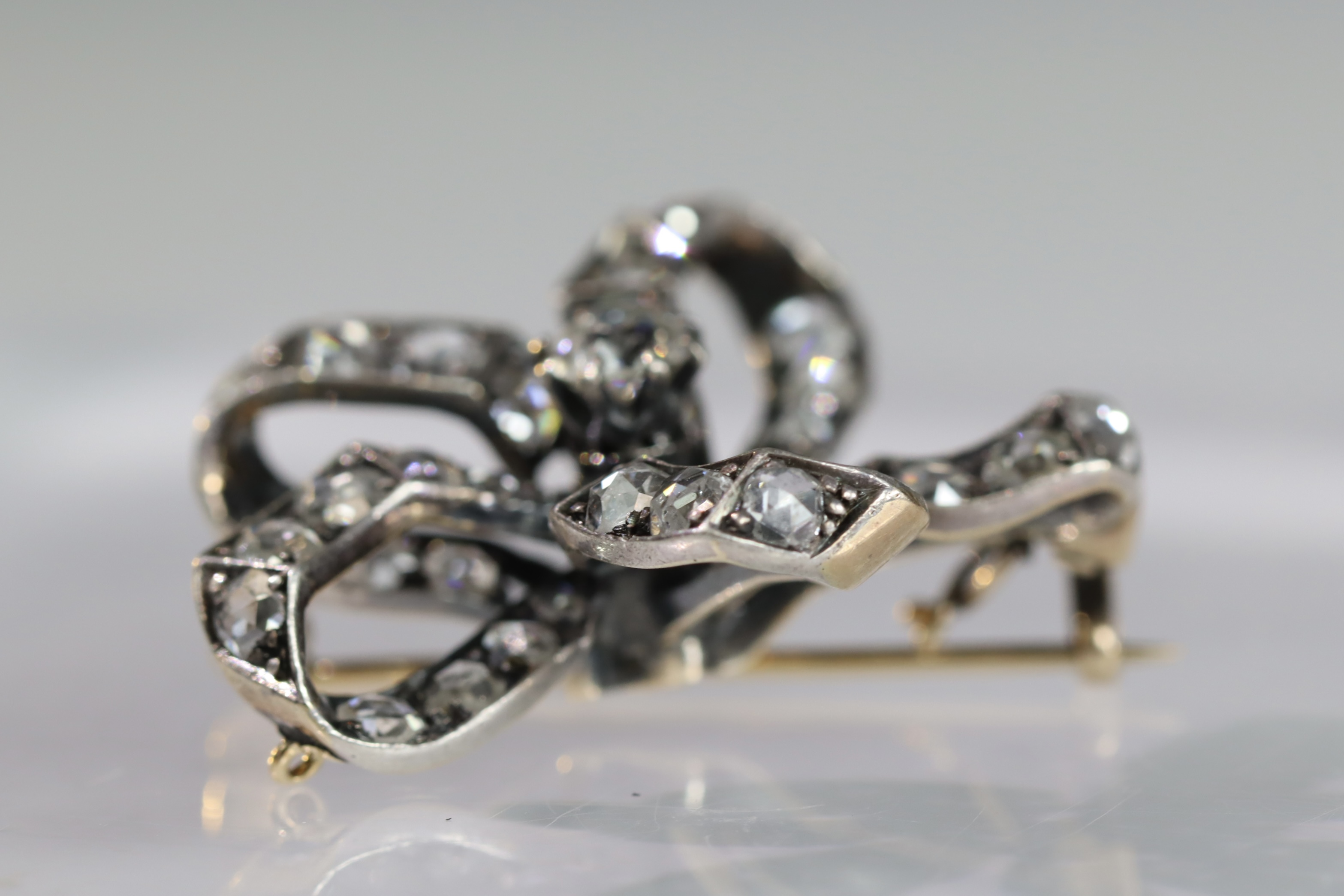 An Antique Diamond and a rose-cut Diamond Stylised Bow Brooch, circa 1890, centrally set with a - Image 8 of 13