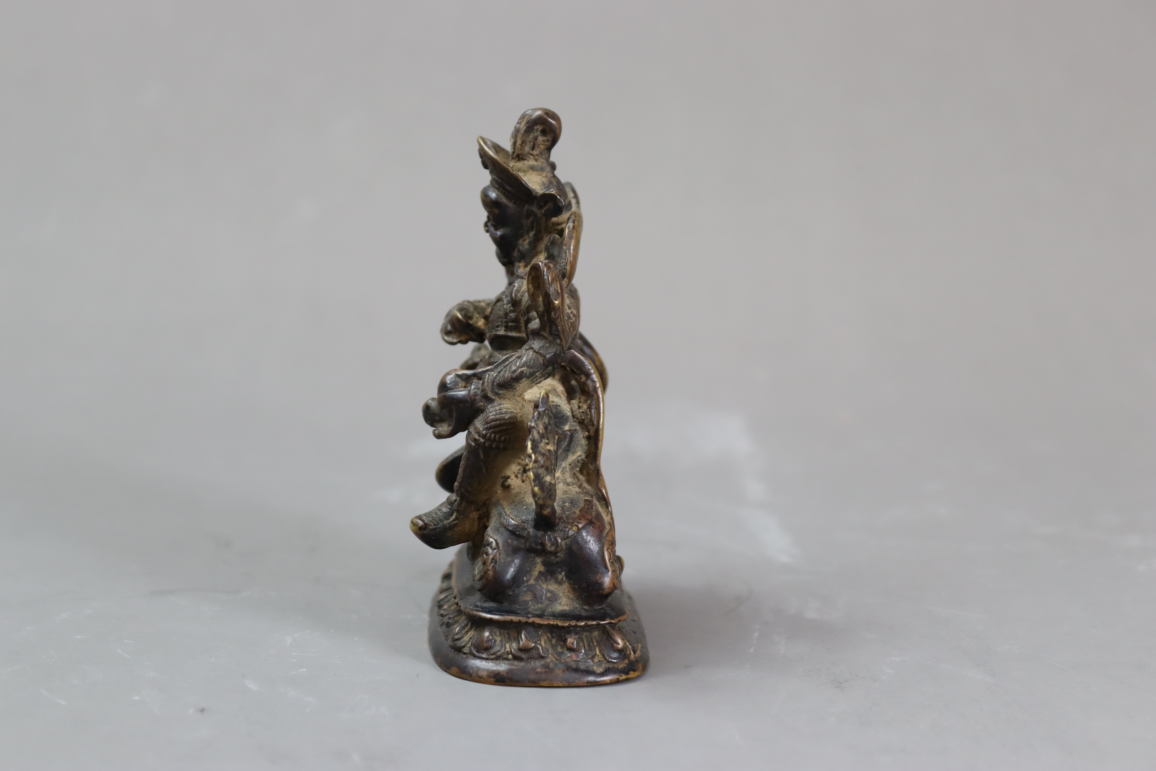 A Bronze God of Fortune, 19/20th centurythe fierce bearded deity clutching his mongoose, with dark - Image 6 of 8