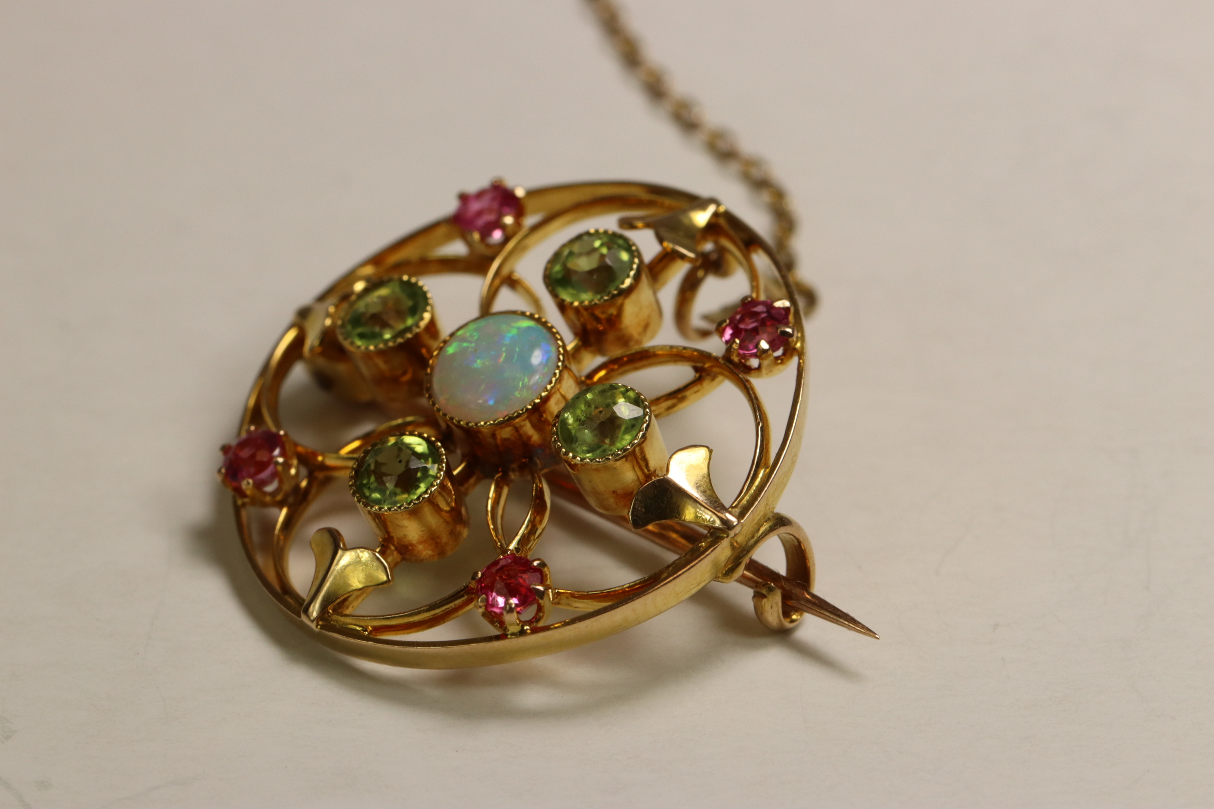 An Antique Opal, Peridot and Pink Stone Target Brooch, circa 1910 Millegraine set central opal, - Image 4 of 7